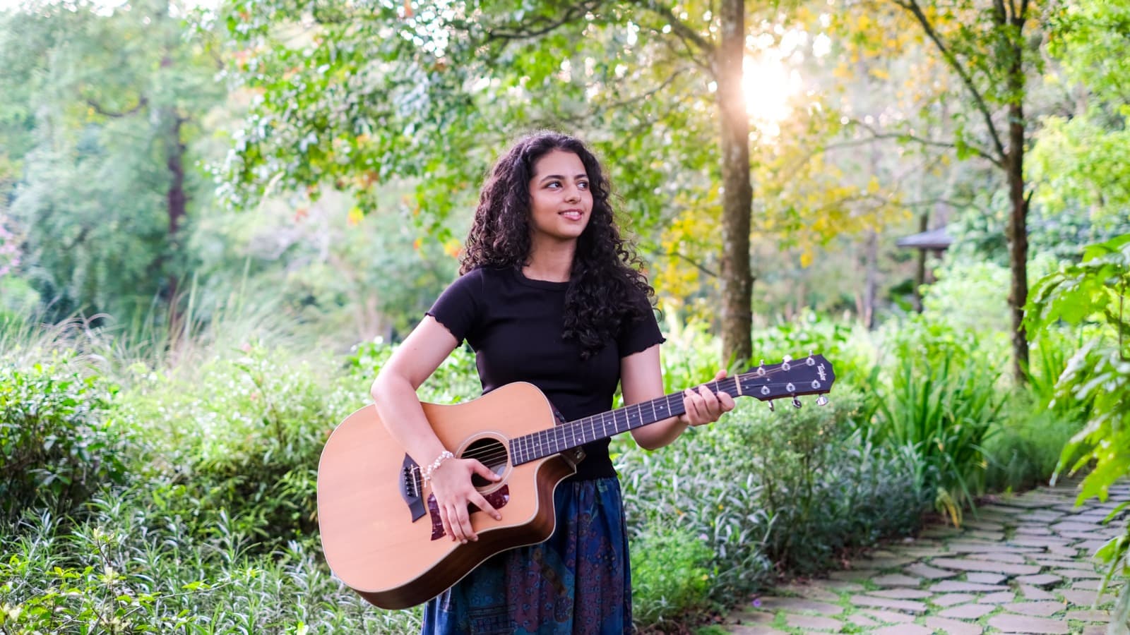 Portrait of Tara in performance poster